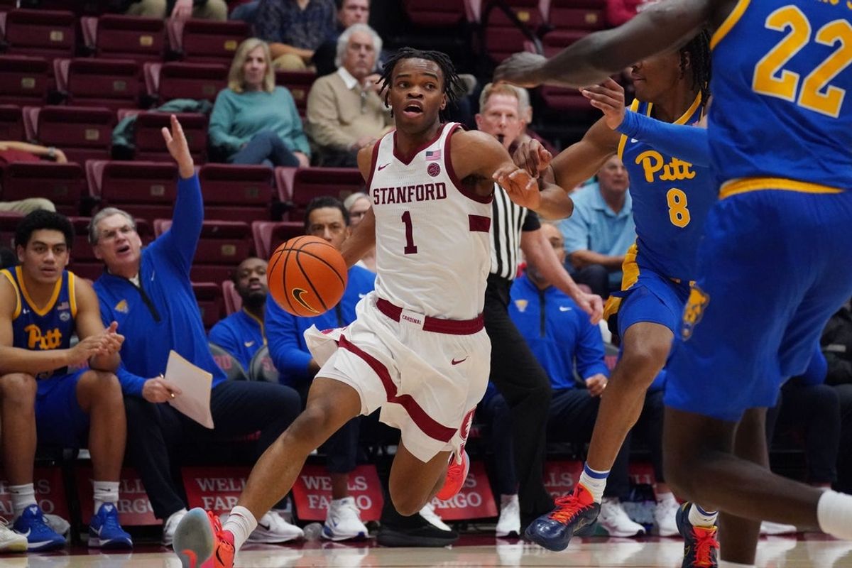 Feb 25, 2026; Stanford, California, USA;  Stanford Cardinal guard Ebuka Okorie (1) dribbles by Pittsburgh Panthers guard Omari Witherspoon (8) and toward guard/forward Barry Dunning Jr. (22) in the first half at Maples Pavilion. Mandatory Credit: David Gonzales-Imagn Images
