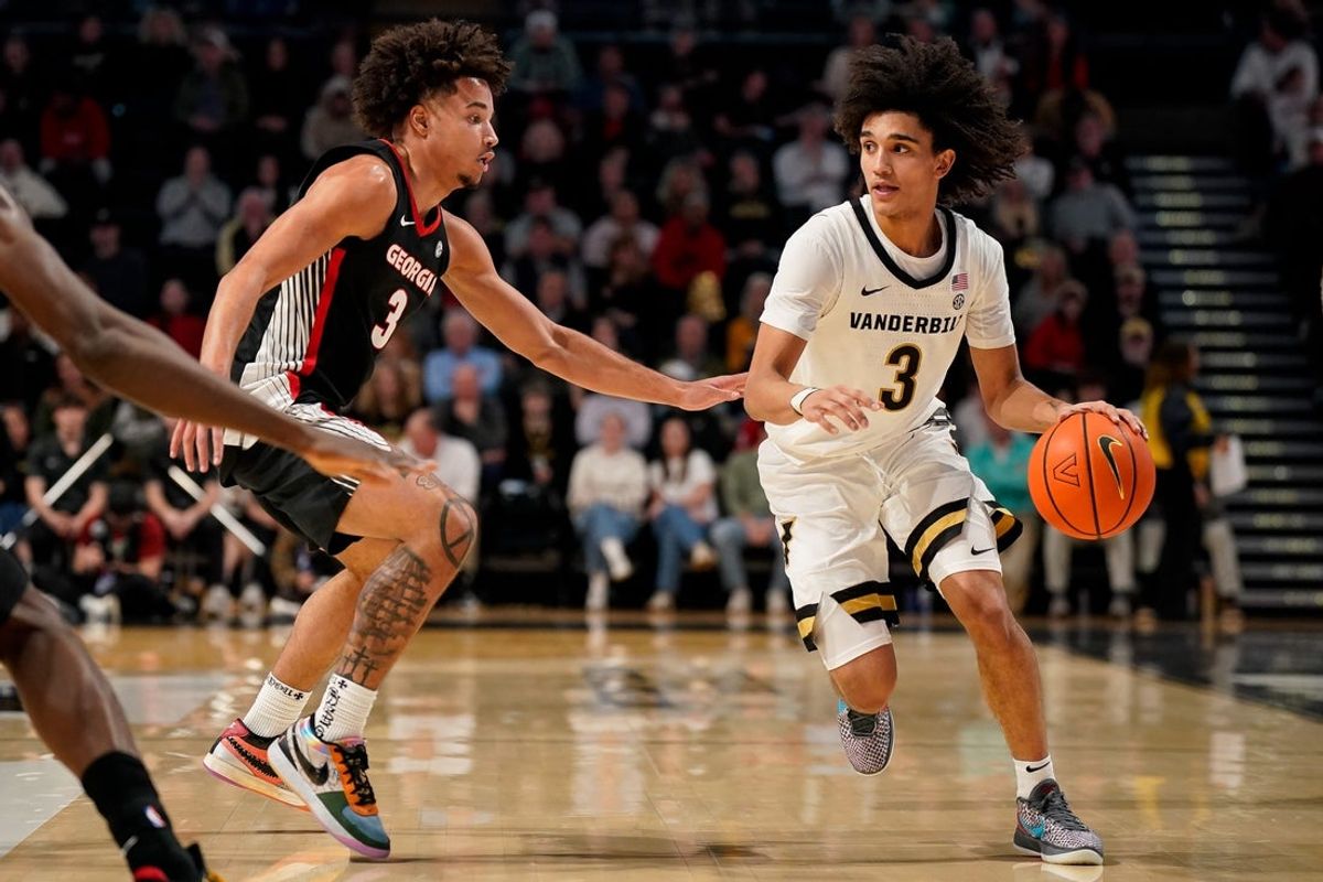 Vanderbilt guard Tyler Tanner (3) pushes up the court with Georgia guard Jordan Ross (3) during the second half at Memorial Gym in Nashville, Tenn., Wednesday, Feb. 25, 2026.