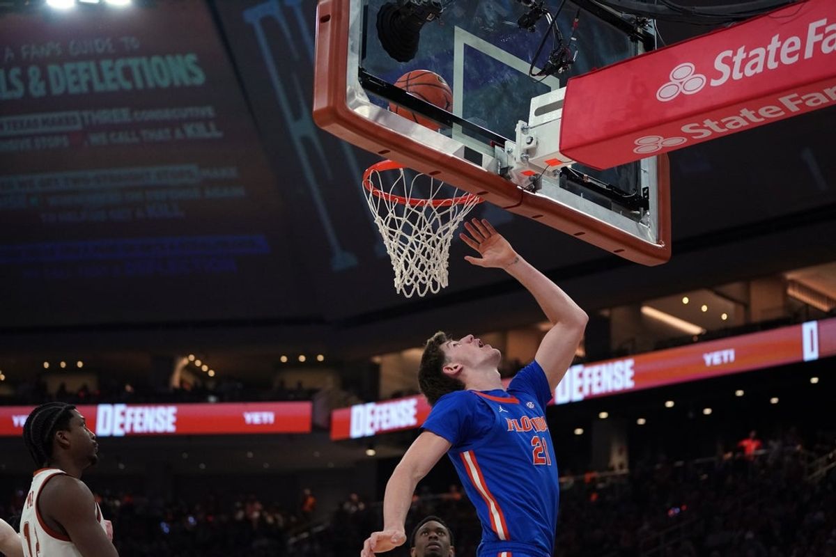 Feb 25, 2026; Austin, Texas, USA; Florida Gators forward Alex Condon (21) makes a lay up during the second half against the Texas Longhorns at Moody Center. Mandatory Credit: Dustin Safranek-Imagn Images