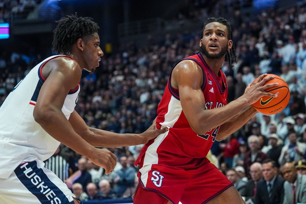 Feb 25, 2026; Hartford, Connecticut, USA; St. John's Red Storm forward Zuby Ejiofor (24) looks for an opening against UConn Huskies forward Tarris Reed Jr. (5) in the second half at PeoplesBank Arena. Mandatory Credit: David Butler II-Imagn Images