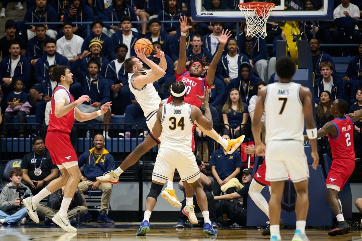Feb 25, 2026; Berkeley, California, USA; California Golden Bears forward John Camden (2) shoots the ball against SMU Mustangs guard B.J. Edwards (0) during the first half at Haas Pavilion. Mandatory Credit: Robert Edwards-Imagn Images