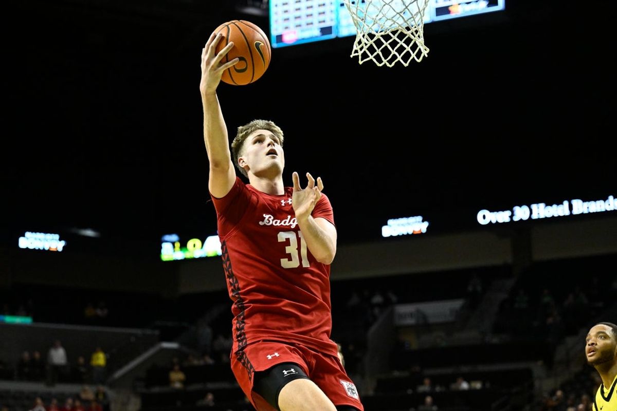 Feb 25, 2026; Eugene, Oregon, USA; Wisconsin Badgers forward Nolan Winter (31) scores during the second half against the Oregon Ducks at Matthew Knight Arena. Mandatory Credit: Craig Strobeck-Imagn Images