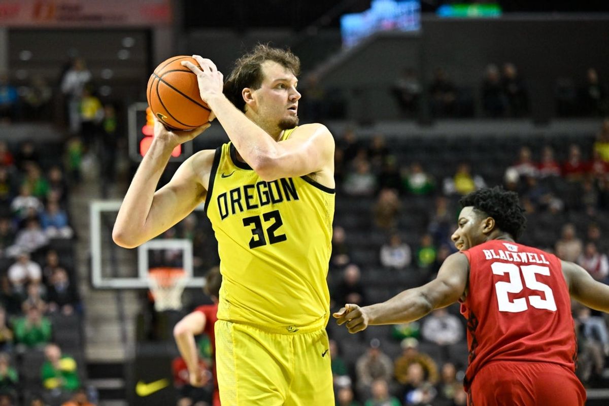 Feb 25, 2026; Eugene, Oregon, USA; Oregon Ducks center Nate Bittle (32) grabs a rebound during the second half against the Wisconsin Badgers at Matthew Knight Arena. Mandatory Credit: Craig Strobeck-Imagn Images