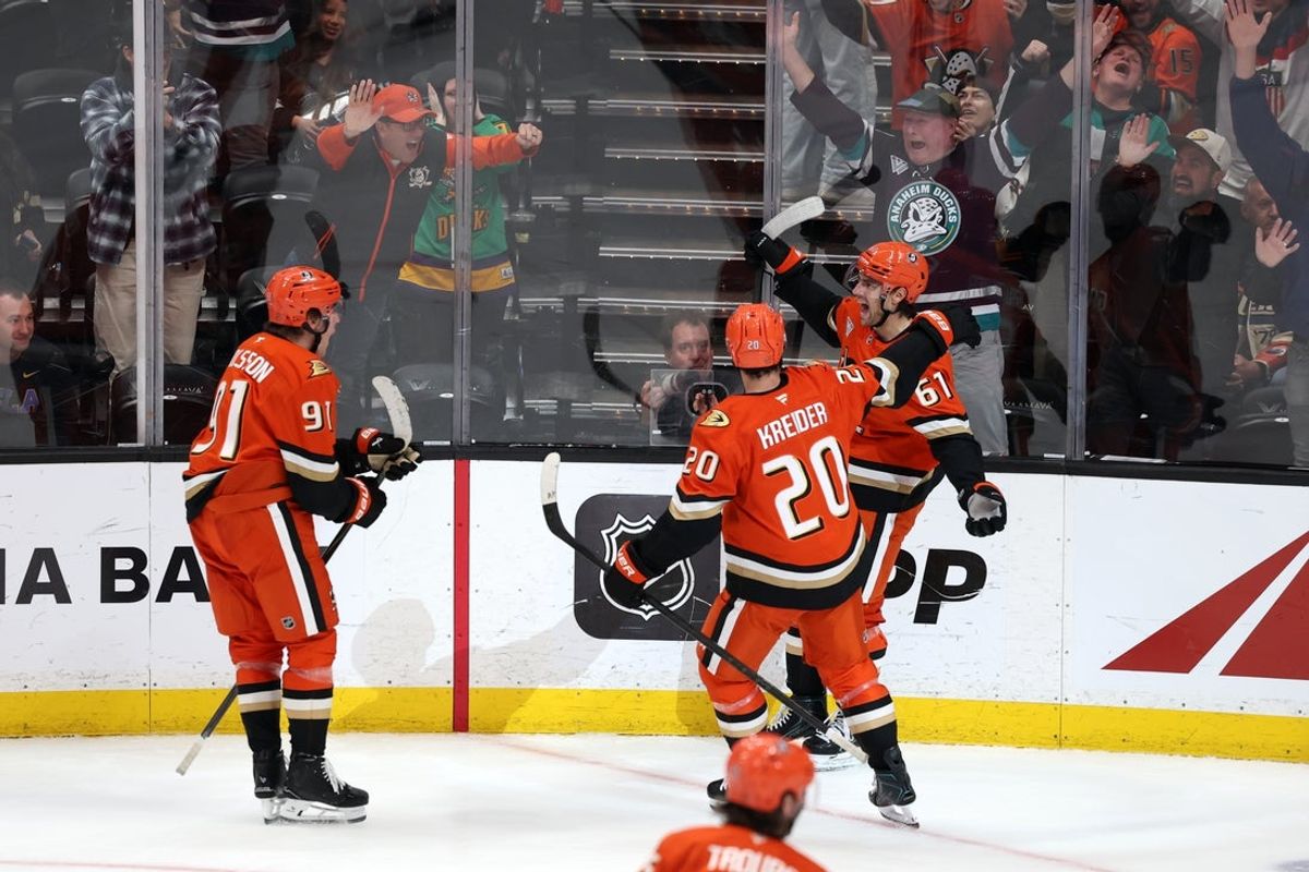Feb 25, 2026; Anaheim, California, USA;  Anaheim Ducks left wing Cutter Gauthier (61) celebrates with center Leo Carlsson (91) and left wing Chris Kreider (20) after scoring a goal during the third period against the Edmonton Oilers at Honda Center. Mandatory Credit: Kiyoshi Mio-Imagn Images