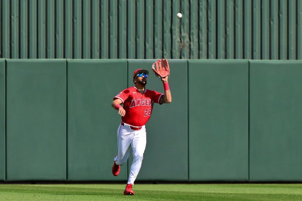 Feb 26, 2026; Tempe, Arizona, USA; Los Angeles Angels outfielder Jose Siri (28) catches a fly ball in the second inning against the Chicago Cubs at Tempe Diablo Stadium. Mandatory Credit: Matt Kartozian-Imagn Images