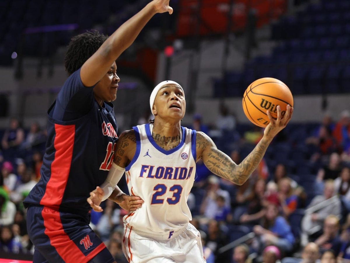 Florida guard Liv McGill (23) shoots past Mississippi forward Christeen Iwuala (12) during the first half of an NCAA women’s basketball game at Steven C. O'Connell Center Exactek arena in Gainesville, FL on Thursday, February 26, 2026. [Alan Youngblood/Gainesville Sun]
