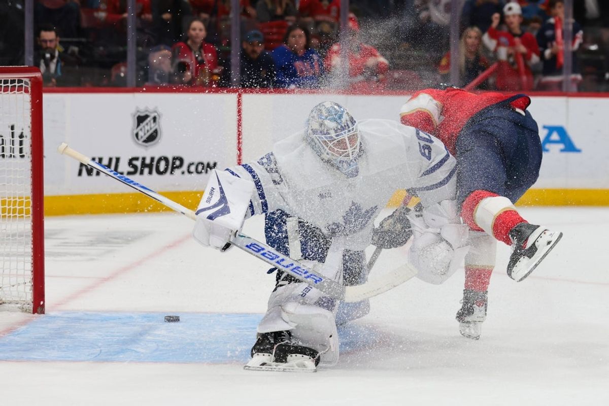 Feb 26, 2026; Sunrise, Florida, USA; Florida Panthers center Evan Rodrigues (17) scores against Toronto Maple Leafs goaltender Joseph Woll (60) during the first period at Amerant Bank Arena. Mandatory Credit: Sam Navarro-Imagn Images