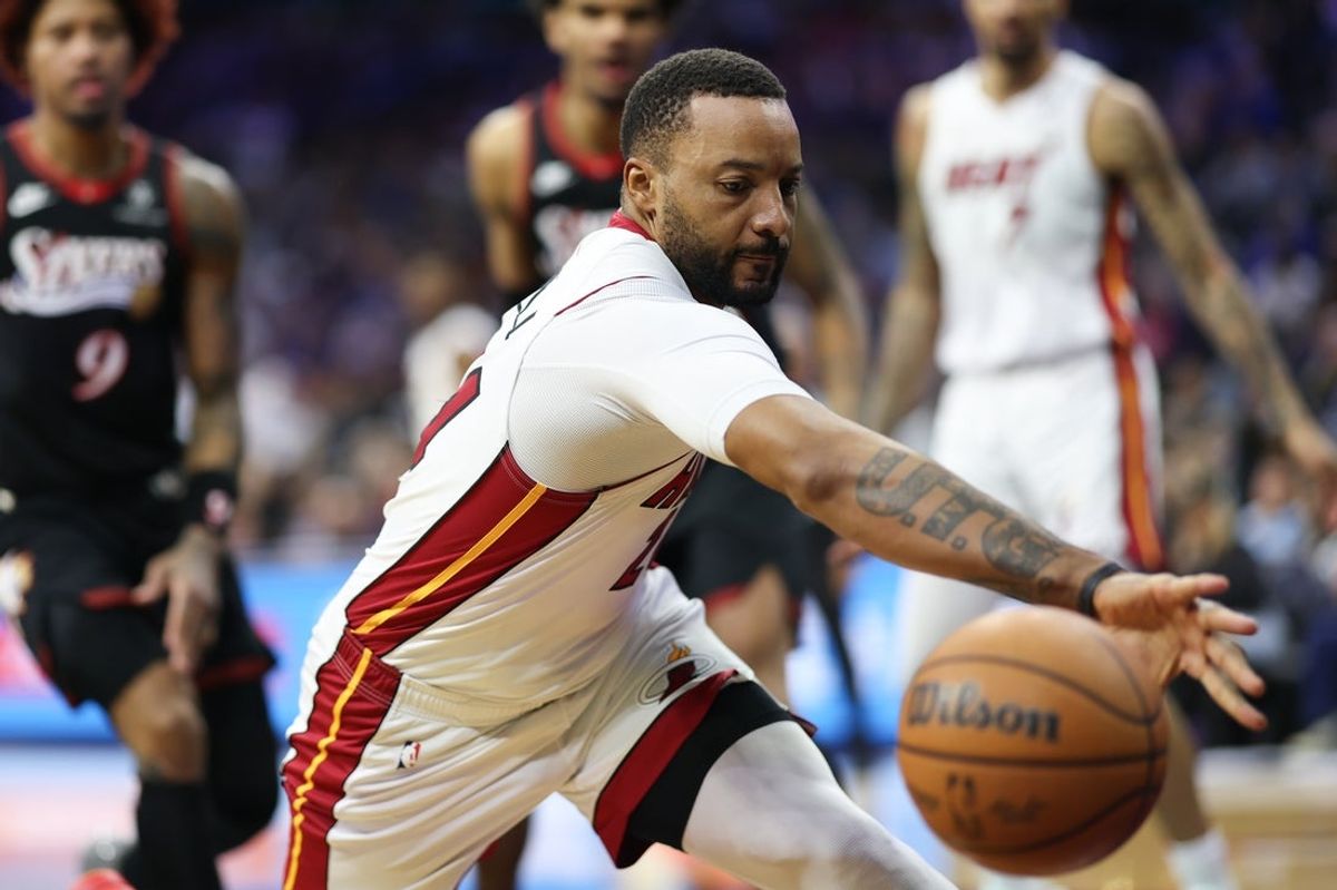 Feb 26, 2026; Philadelphia, Pennsylvania, USA; Miami Heat guard Norman Powell (24) reaches for a loose ball against the Philadelphia 76ers during the second quarter at Xfinity Mobile Arena. Mandatory Credit: Bill Streicher-Imagn Images