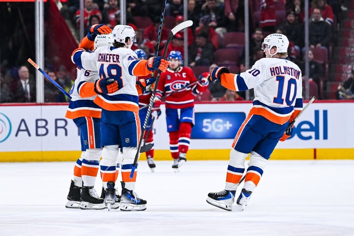 Feb 26, 2026; Montreal, Quebec, CAN; New York Islanders defenseman Matthew Schaefer (48) celebrates with right wing Simon Holmstrom (10) his second goal of the game against the Montreal Canadiens during the second period at Bell Centre. Mandatory Credit: David Kirouac-Imagn Images