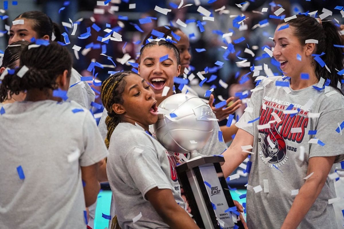 Feb 26, 2026; Hartford, Connecticut, USA; UConn Huskies guard Azzi Fudd (35), guard Kelis Fisher (7), guard Caroline Ducharme (33) and teammates celebrate their Big East Regular Season Title after defeating the Georgetown Hoyas at PeoplesBank Arena. Mandatory Credit: David Butler II-Imagn Images