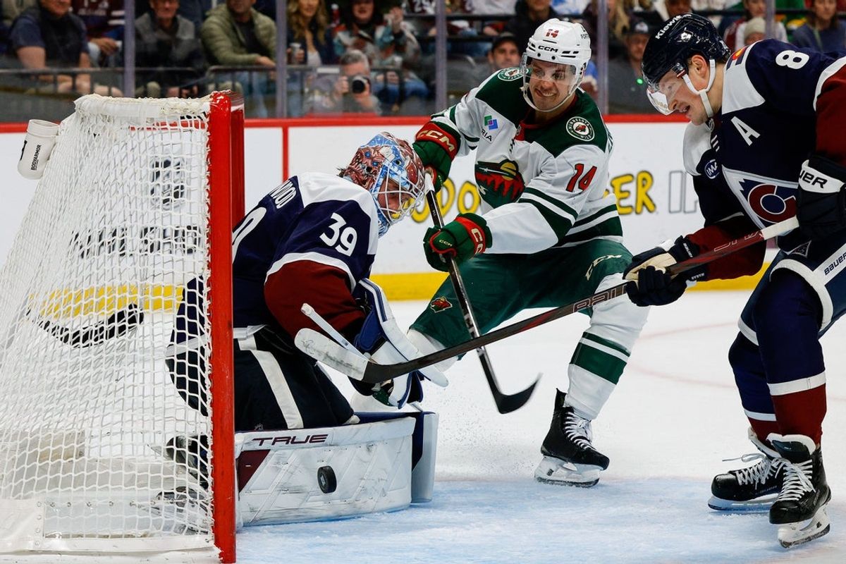 Feb 26, 2026; Denver, Colorado, USA; Colorado Avalanche goaltender MacKenzie Blackwood (39) makes a save against Minnesota Wild center Joel Eriksson Ek (14) as defenseman Cale Makar (8) defends in the first period at Ball Arena. Mandatory Credit: Isaiah J. Downing-Imagn Images