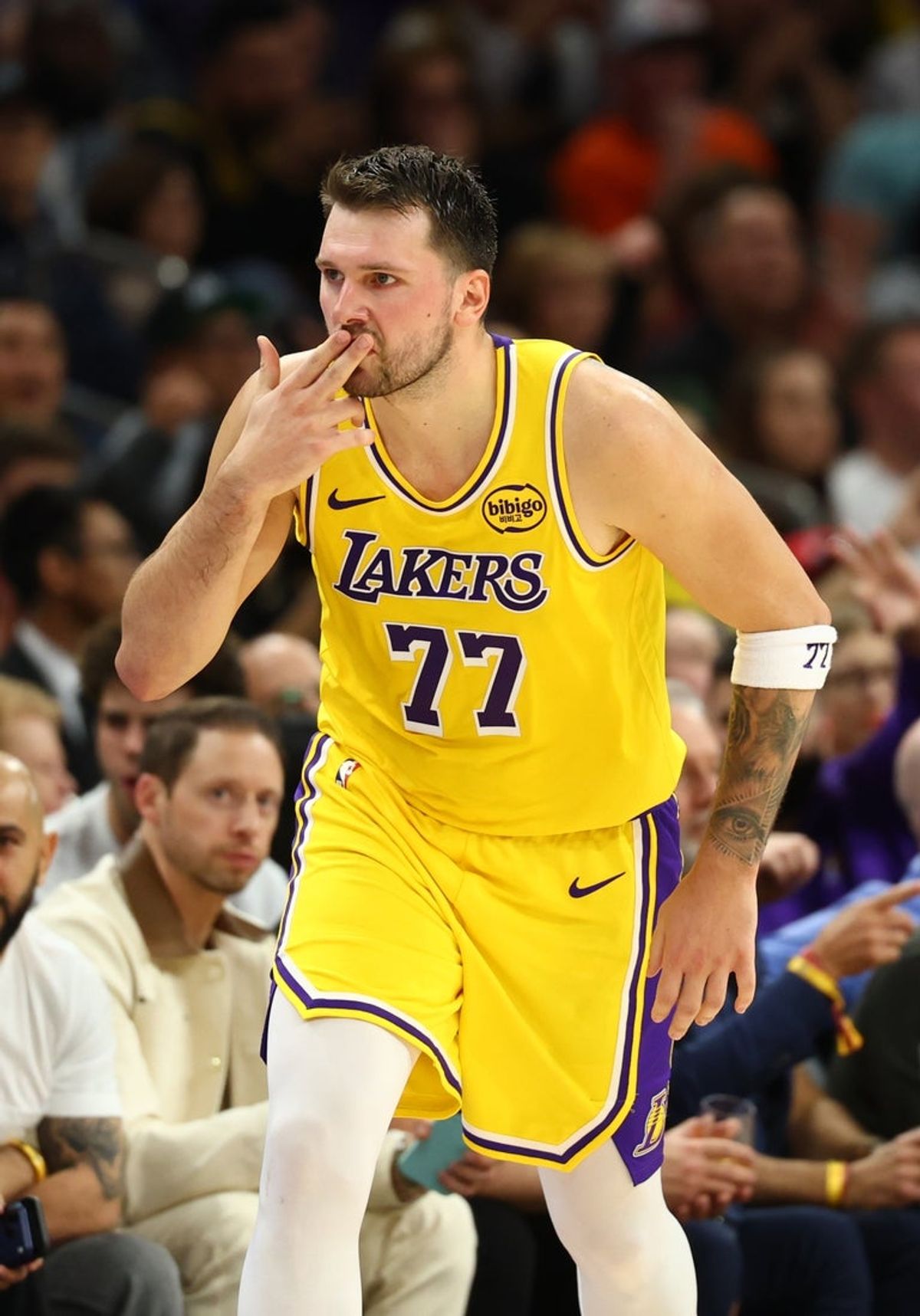 Feb 26, 2026; Phoenix, Arizona, USA; Los Angeles Lakers guard Luka Doncic (77) kisses his fingers as he celebrates a three point shot against the Phoenix Suns in the first half at Mortgage Matchup Center. Mandatory Credit: Mark J. Rebilas-Imagn Images