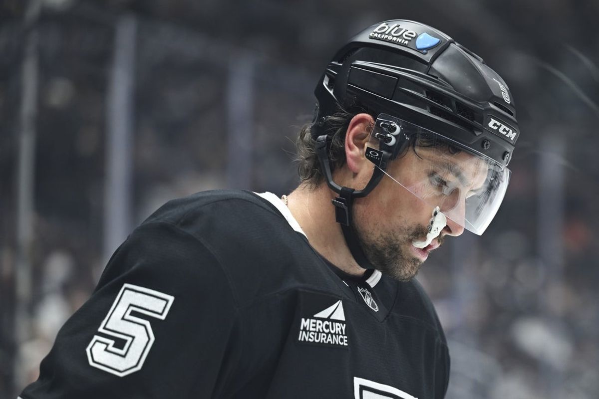 Feb 26, 2026; Los Angeles, California, USA; Los Angeles Kings defenseman Cody Ceci (5) skates between during the first period against the Edmonton Oilers at Crypto.com Arena. Mandatory Credit: Griffin Hooper-Imagn Images