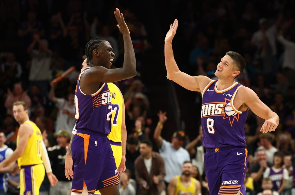 Feb 26, 2026; Phoenix, Arizona, USA; Phoenix Suns guard Grayson Allen (8) celebrates with forward Rasheer Fleming (20) against the Los Angeles Lakers in the second half at Mortgage Matchup Center. Mandatory Credit: Mark J. Rebilas-Imagn Images