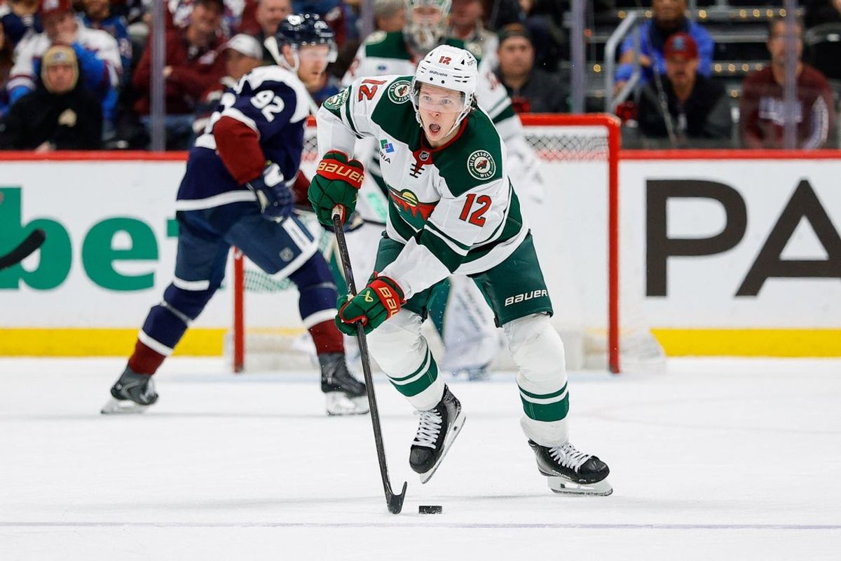 Feb 26, 2026; Denver, Colorado, USA; Minnesota Wild left wing Matt Boldy (12) skates with the puck towards an open net in the third period against the Colorado Avalanche at Ball Arena. Mandatory Credit: Isaiah J. Downing-Imagn Images
