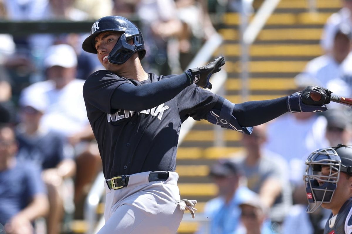 Feb 27, 2026; Fort Myers, Florida, USA; New York Yankees shortstop George Lombard Jr. (96) hits a two-rbi single against the Minnesota Twins in the first inning during spring training at Lee Health Sports Complex/Hammond Stadium. Mandatory Credit: Nathan Ray Seebeck-Imagn Images