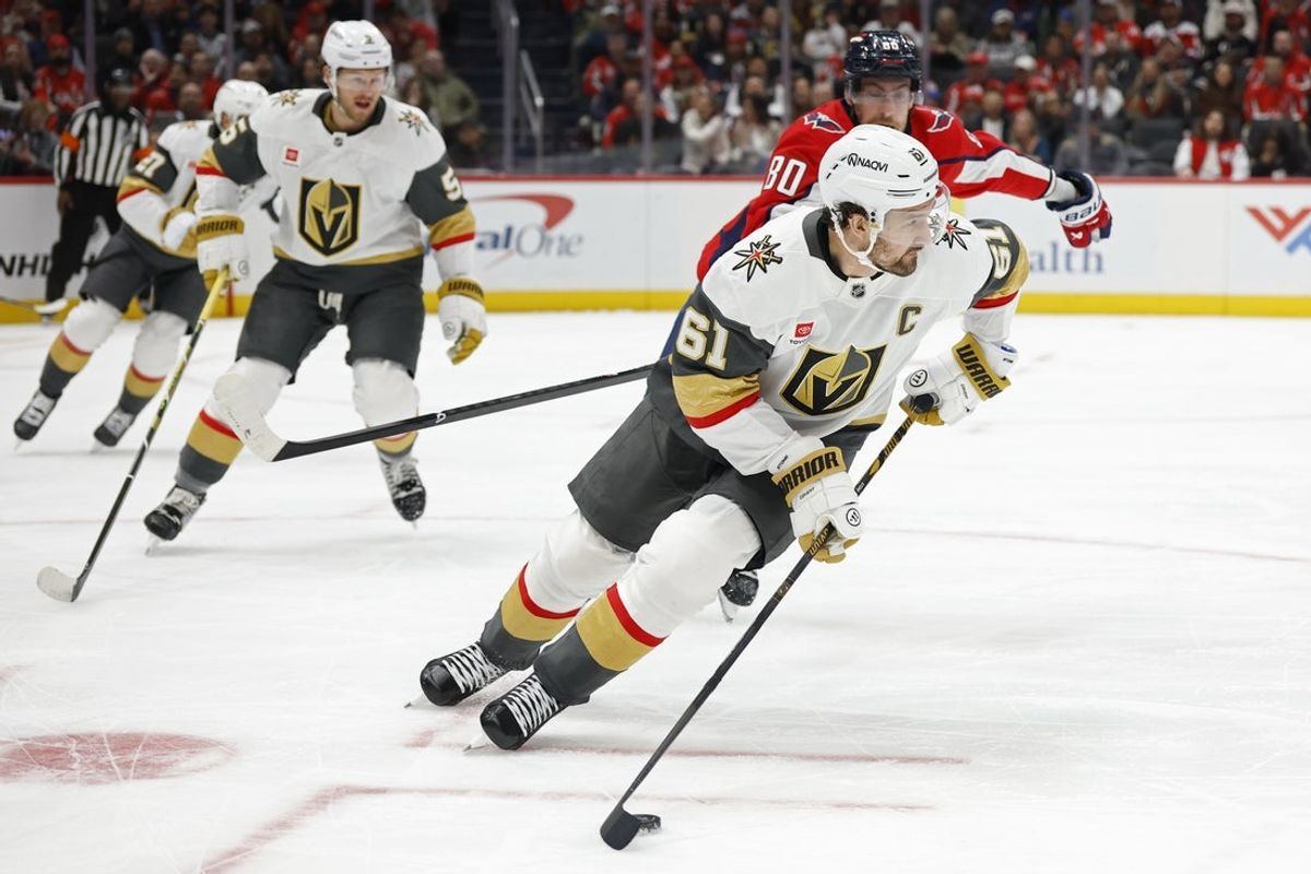 Feb 27, 2026; Washington, District of Columbia, USA; Vegas Golden Knights right wing Mark Stone (61) skates with the puck as Washington Capitals left wing Pierre-Luc Dubois (80) /chases during the first period at Capital One Arena. Mandatory Credit: Geoff Burke-Imagn Images