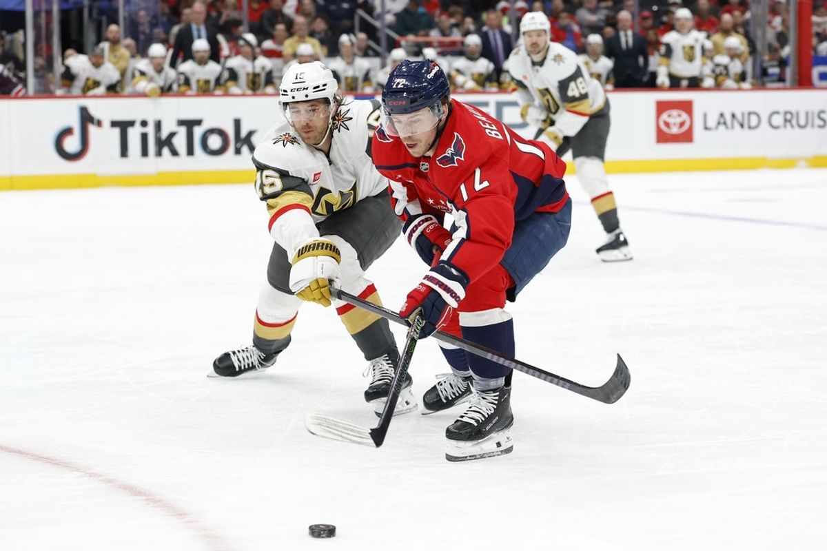 Feb 27, 2026; Washington, District of Columbia, USA; Washington Capitals left wing Anthony Beauvillier (72) and Vegas Golden Knights defenseman Noah Hanfin (15) battle for the puck during the first period at Capital One Arena. Mandatory Credit: Geoff Burke-Imagn Images