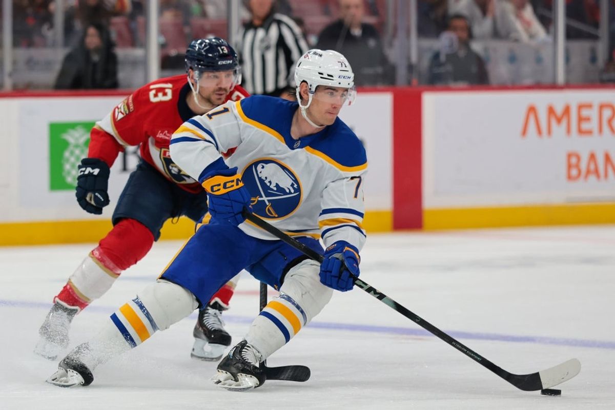 Feb 27, 2026; Sunrise, Florida, USA;  Buffalo Sabres center Ryan McLeod (71) moves the puck against Florida Panthers center Sam Reinhart (13) during the first period at Amerant Bank Arena. Mandatory Credit: Sam Navarro-Imagn Images