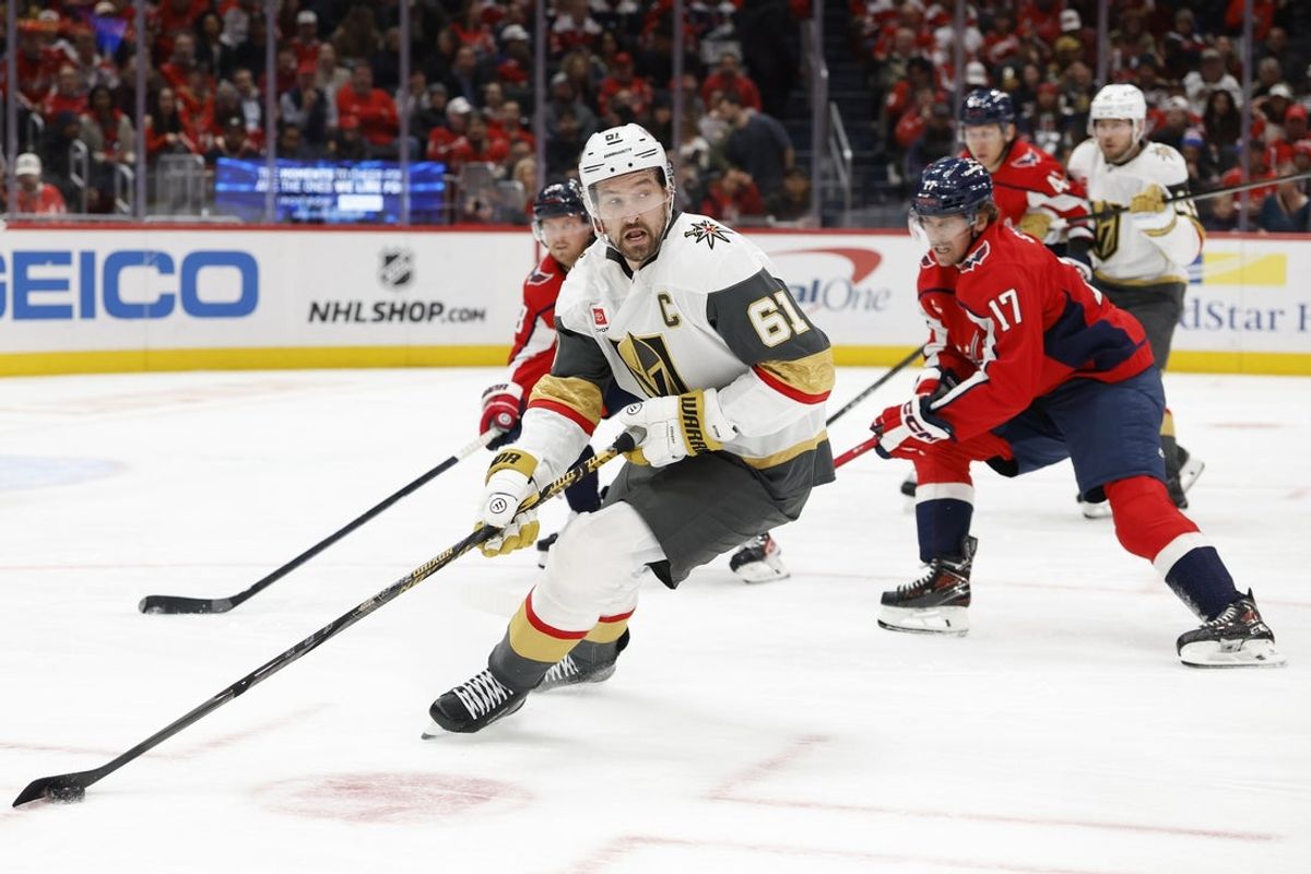Feb 27, 2026; Washington, District of Columbia, USA; Vegas Golden Knights right wing Mark Stone (61) skates with the puck as Washington Capitals center Dylan Strome (17) chases during the second period at Capital One Arena. Mandatory Credit: Geoff Burke-Imagn Images