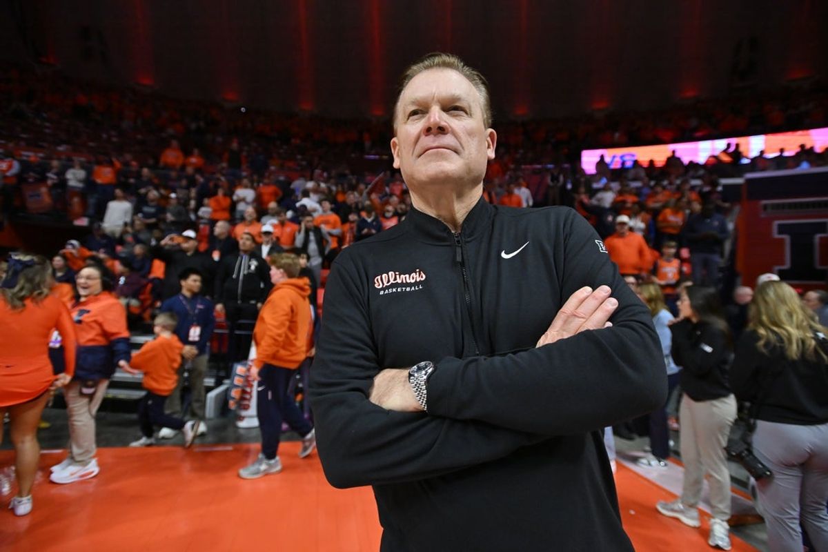 Feb 27, 2026; Champaign, Illinois, USA;  Illinois Fighting Illini head coach Brad Underwood greets the crowd before the first half against the Michigan Wolverines at State Farm Center. Mandatory Credit: Ron Johnson-Imagn Images