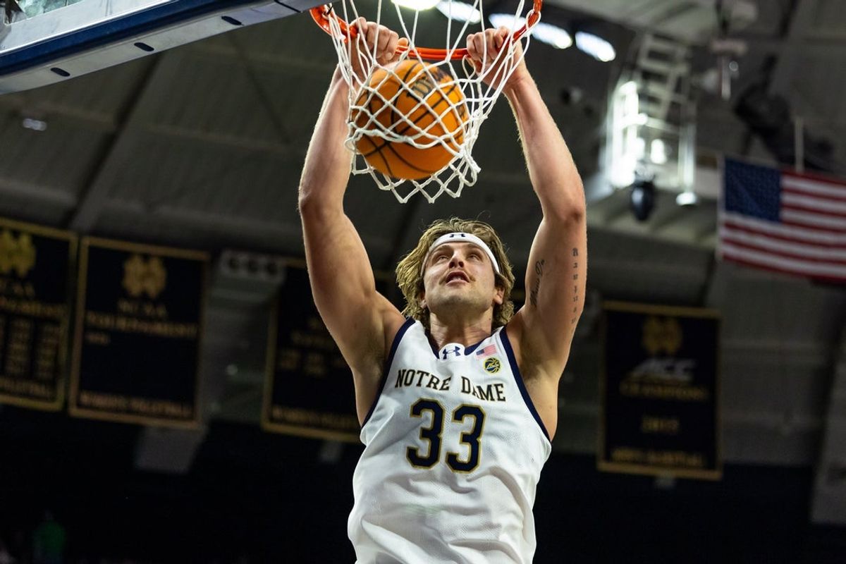 Feb 28, 2026; South Bend, Indiana, USA; Notre Dame Fighting Irish forward Carson Towt (33) dunks against the NC State Wolfpack during the first half at Purcell Pavilion at the Joyce Center. Mandatory Credit: Michael Caterina-Imagn Images