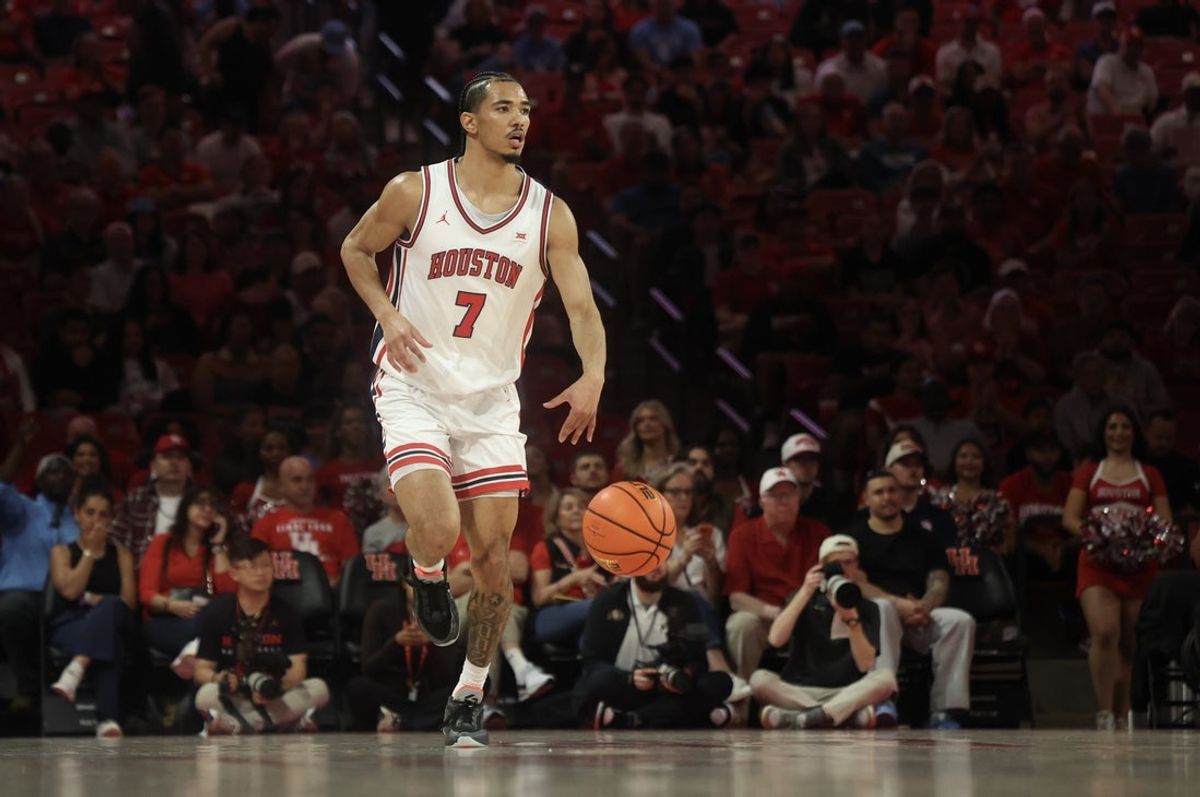 Feb 28, 2026; Houston, Texas, USA;  Houston Cougars guard Milos Uzan (7) dribbles against the Colorado Buffaloes in the first half at Fertitta Center. Mandatory Credit: Thomas Shea-Imagn Images