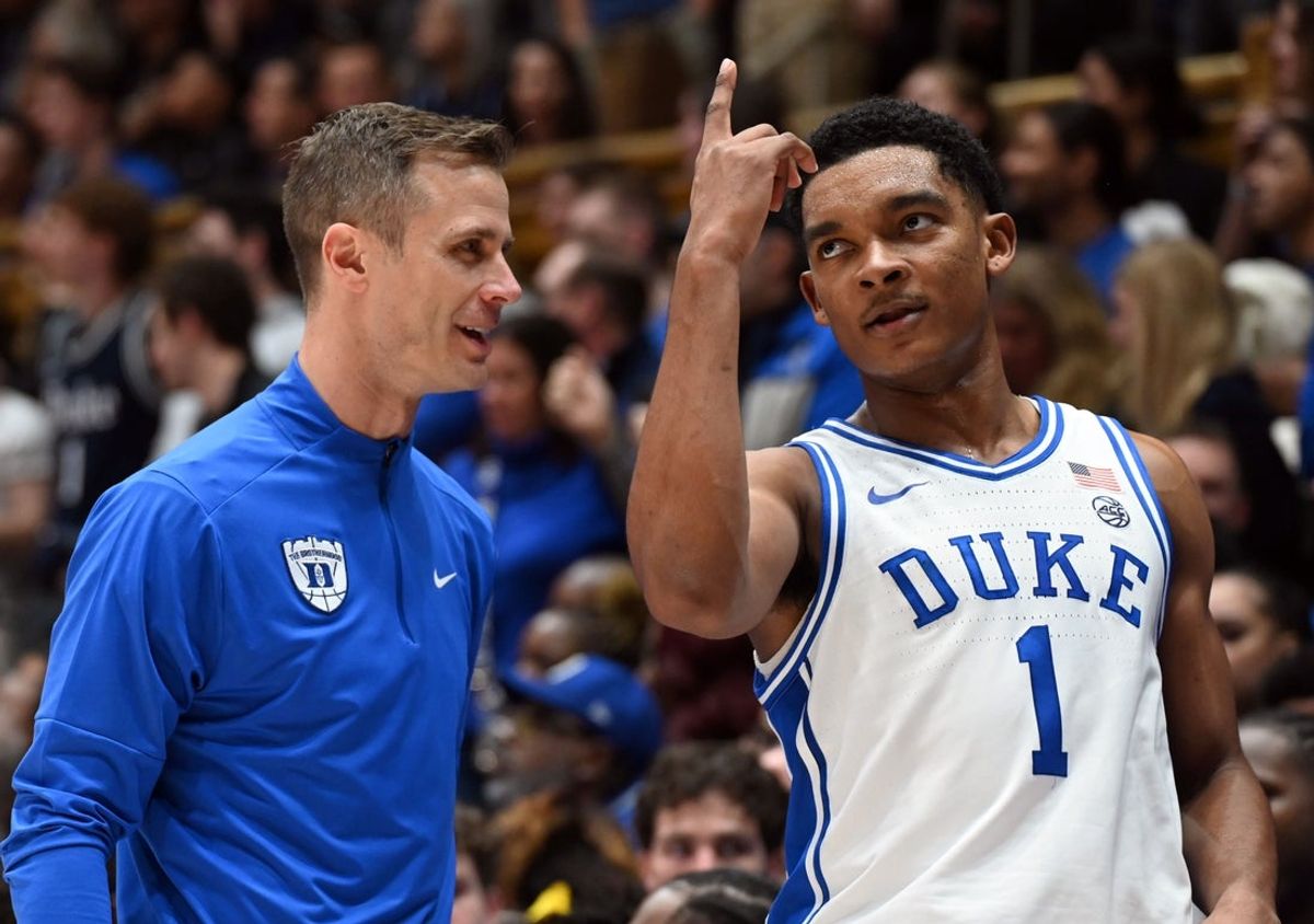 Duke Blue Devils guard Caleb Foster (1) gestures to head coach Jon Scheyer during the second half against the Virginia Cavaliers at Cameron Indoor Stadium.   Duke won 77-51.  Mandatory Credit: Rob Kinnan-Imagn Images
