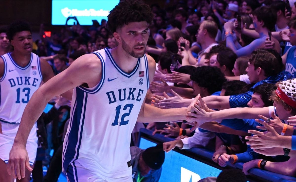 Feb 28, 2026; Durham, North Carolina, USA; Duke Blue Devils forward Cameron Boozer (12) greets fans after a win over the Virginia Cavaliers at Cameron Indoor Stadium.   Duke won 77-51.  Mandatory Credit: Rob Kinnan-Imagn Images