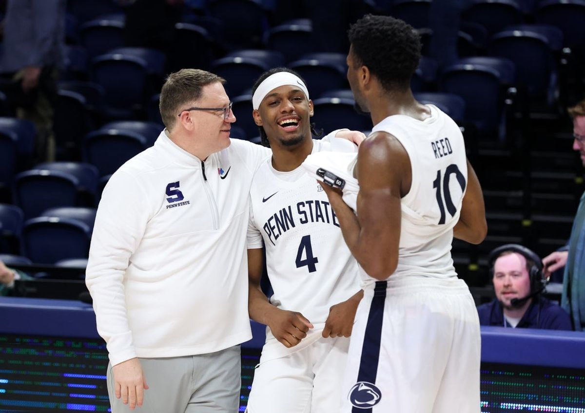 Feb 28, 2026; University Park, Pennsylvania, USA; Penn State Nittany Lions head coach Mike Rhoades shares a moment with guard Kayden Mingo (4) and forward Josh Reed (10) following the game against the Iowa Hawkeyes at Bryce Jordan Center. Mandatory Credit: Matthew O'Haren-Imagn Images