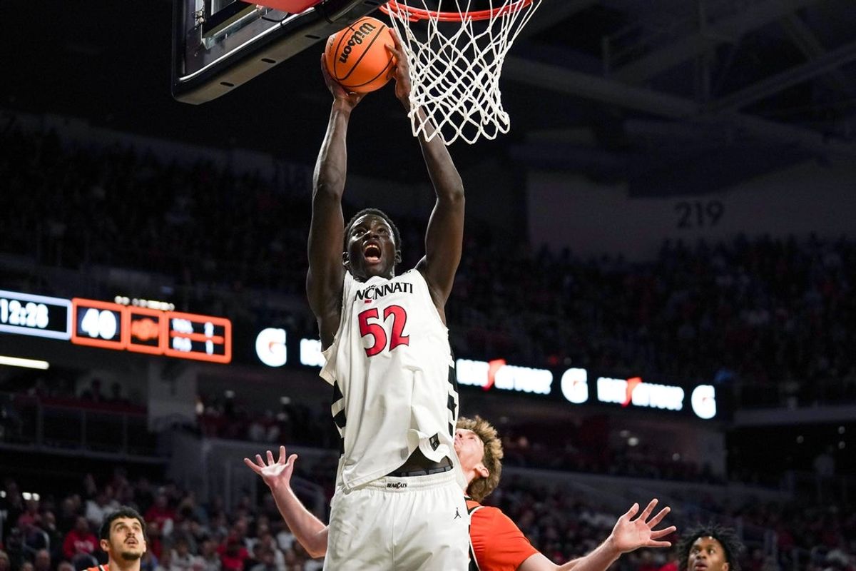 Cincinnati Bearcats center Moustapha Thiam (52) hits a layup in the second half of a NCAA men’s basketball game between the Cincinnati Bearcats and Oklahoma State Cowboys, Saturday, Feb. 28, 2026, at Fifth Third Arena in Cincinnati. Bearcats won 91-68.