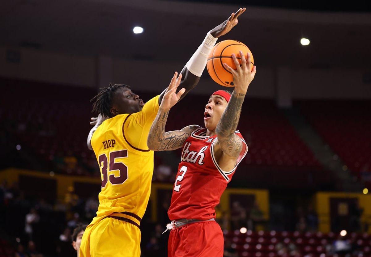 Feb 28, 2026; Tempe, Arizona, USA; Utah Utes guard Terrence Brown (2) drives to the basket against Arizona State Sun Devils center Massamba Diop (35) in the first half at Desert Financial Arena. Mandatory Credit: Mark J. Rebilas-Imagn Images