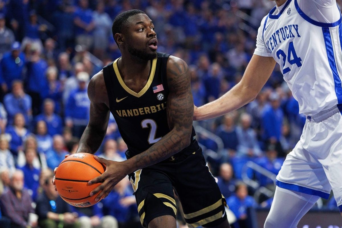 Feb 28, 2026; Lexington, Kentucky, USA; Vanderbilt Commodores guard Duke Miles (2) looks to pass the ball around Kentucky Wildcats center Malachi Moreno (24) during the first half at Rupp Arena at Central Bank Center. Mandatory Credit: Jordan Prather-Imagn Images