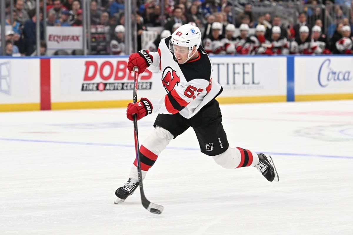 Feb 28, 2026; St. Louis, Missouri, USA; New Jersey Devils left wing Jesper Bratt (63) takes a shot against the St. Louis Blues in the first period at Enterprise Center. Mandatory Credit: Joe Puetz-Imagn Images