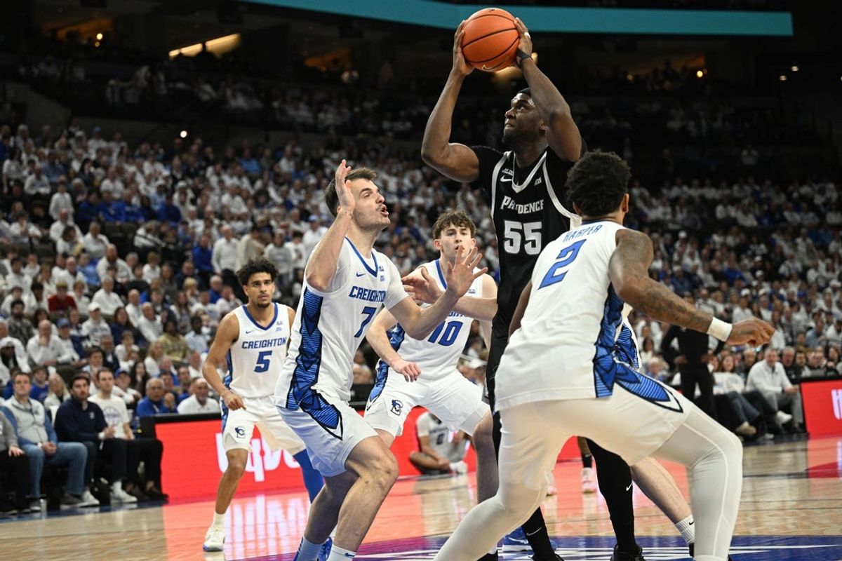 Feb 28, 2026; Omaha, Nebraska, USA;  Providence Friars forward Oswin Erhunmwunse (55) attempts a shot against Creighton Bluejays guard Fedor Zugic (7) and guard Blake Harper (2) during the first half at CHI Health Center Omaha. Mandatory Credit: Steven Branscombe-Imagn Images