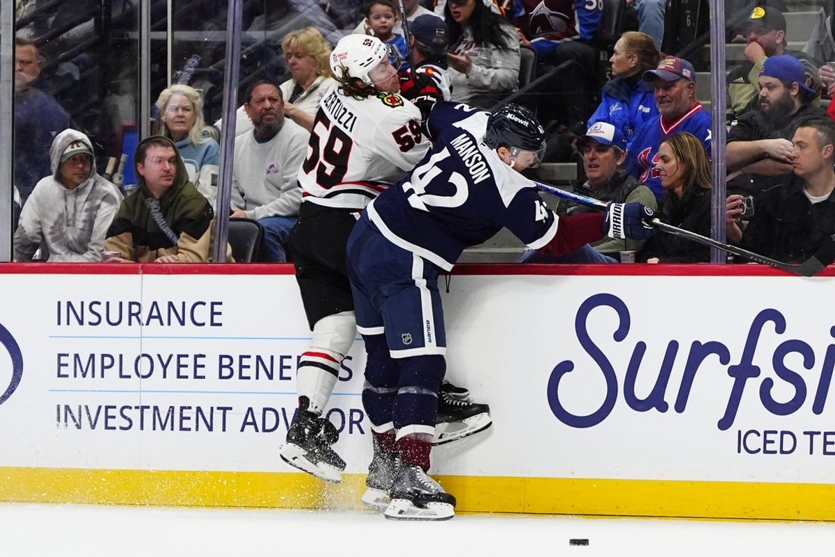 Feb 28, 2026; Denver, Colorado, USA; Colorado Avalanche defenseman Josh Manson (42) hips checks Chicago Blackhawks left wing Tyler Bertuzzi (59) in the first period at Ball Arena. Mandatory Credit: Ron Chenoy-Imagn Images