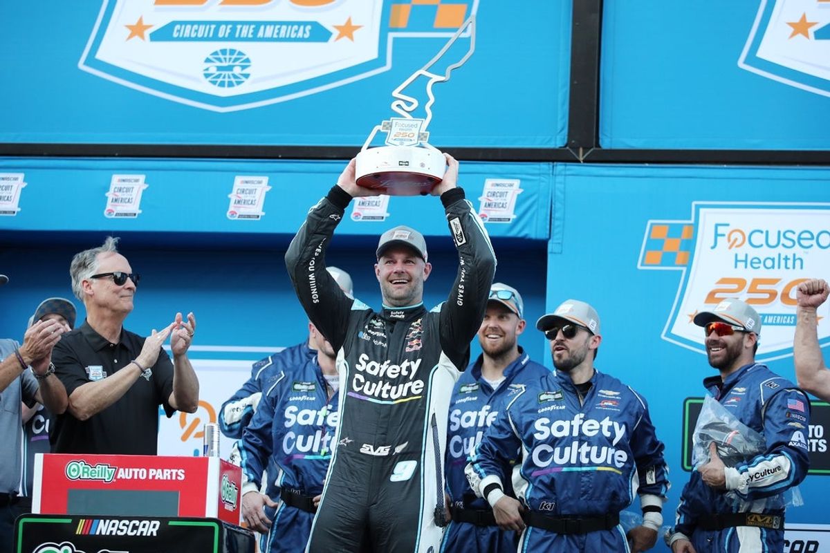Feb 28, 2026; Austin, Texas, USA;  O’Reilly NASCAR O’Reilly Auto Parts Series driver Shane Van Gisbergen (9) with the trophy after winning the NASCAR O’Reilly Auto Parts Series Focused Health 250 at Circuit of the Americas. Mandatory Credit: Michael C. Johnson-Imagn Images