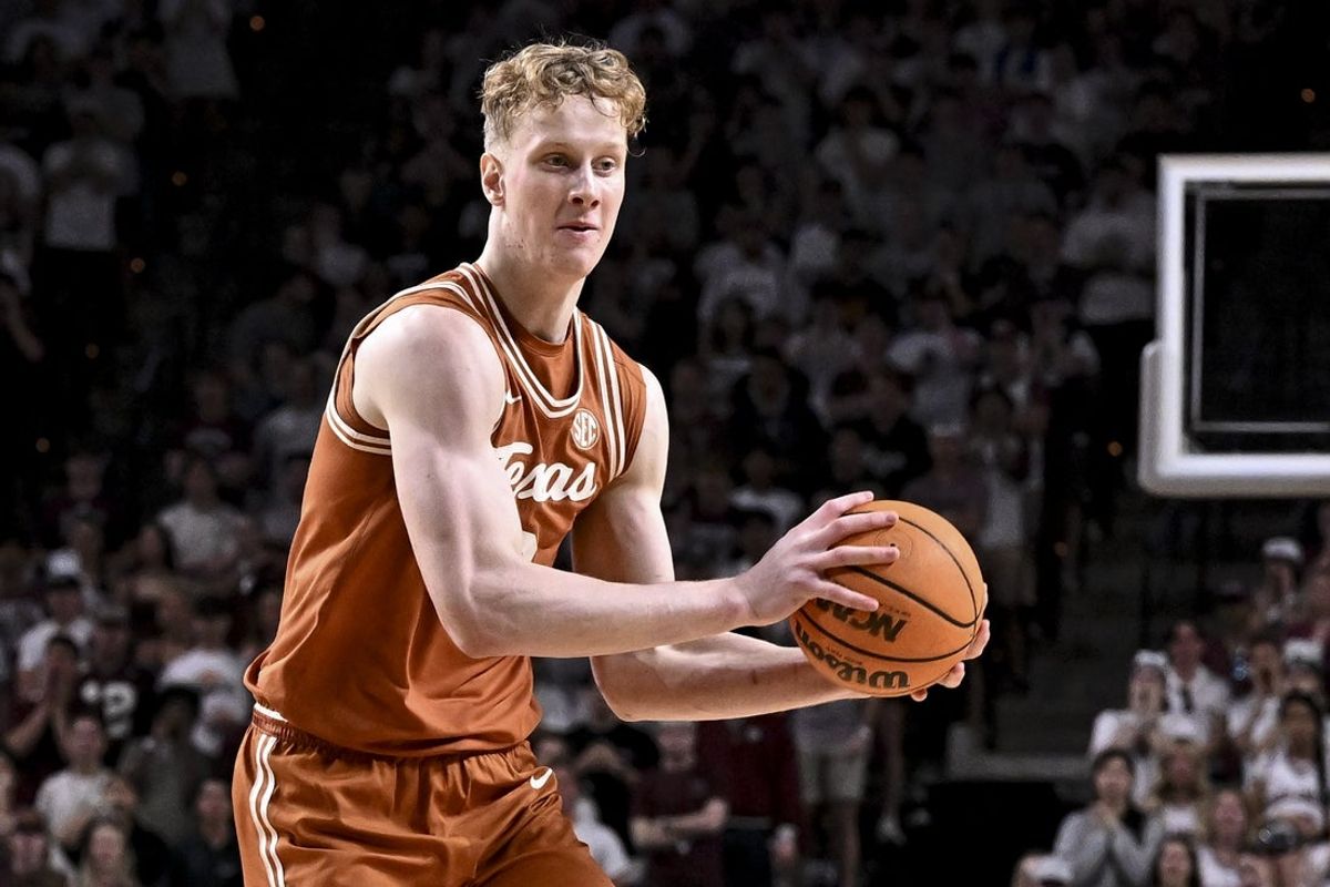 Feb 28, 2026; College Station, Texas, USA; Texas Longhorns center Matas Vokietaitis (8) looks to pass the ball during the first half against the Texas A&M Aggies at Reed Arena. Mandatory Credit: Maria Lysaker-Imagn Images