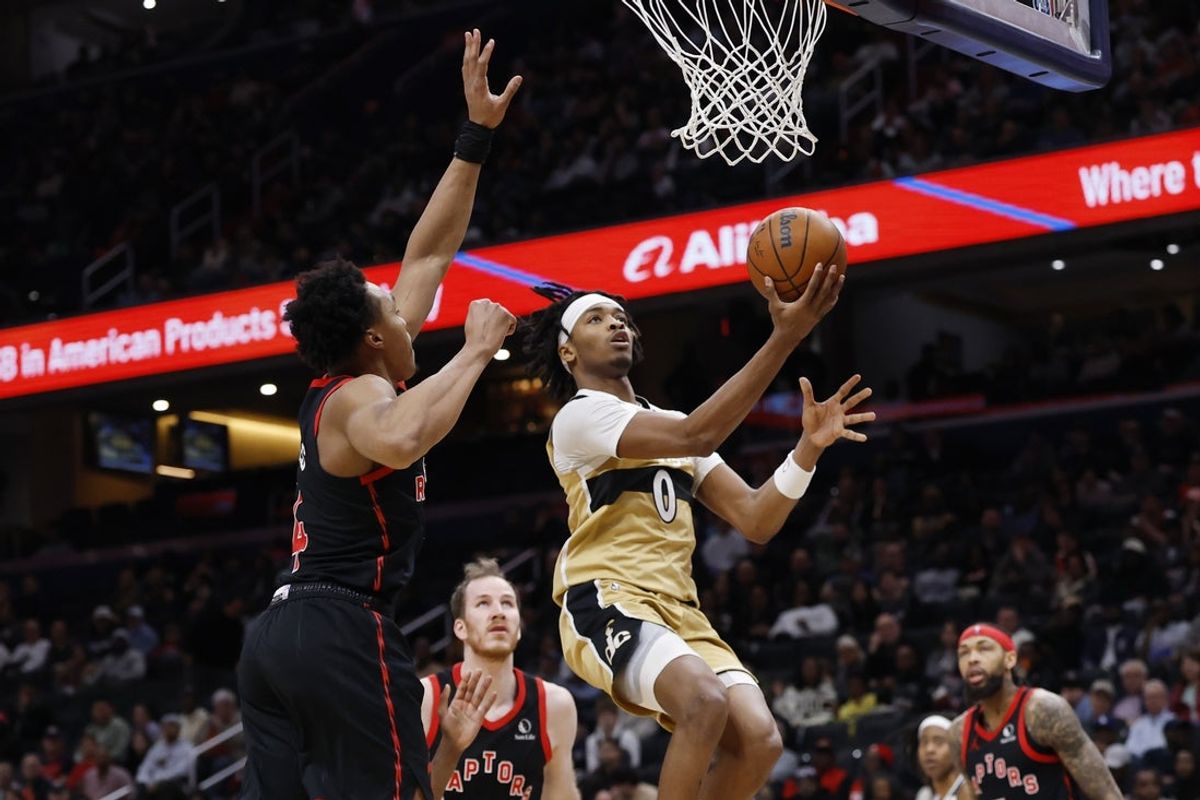 Feb 28, 2026; Washington, District of Columbia, USA; Washington Wizards guard Bilal Coulibaly (0) drives to the basket as Toronto Raptors forward Scottie Barnes (4) defends in the first half at Capital One Arena. Mandatory Credit: Geoff Burke-Imagn Images