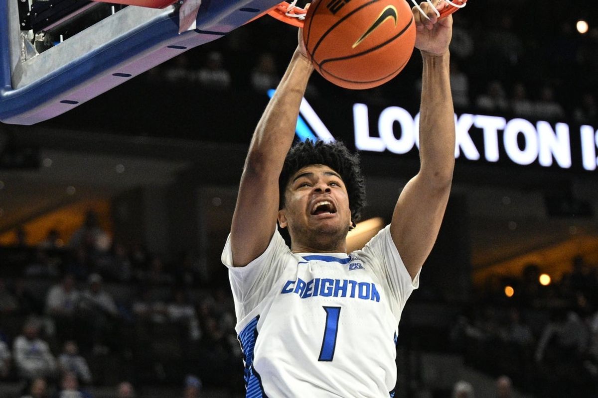 Feb 28, 2026; Omaha, Nebraska, USA;  Creighton Bluejays guard Austin Swartz (1) dunks against the Providence Friars during the second half at CHI Health Center Omaha. Mandatory Credit: Steven Branscombe-Imagn Images