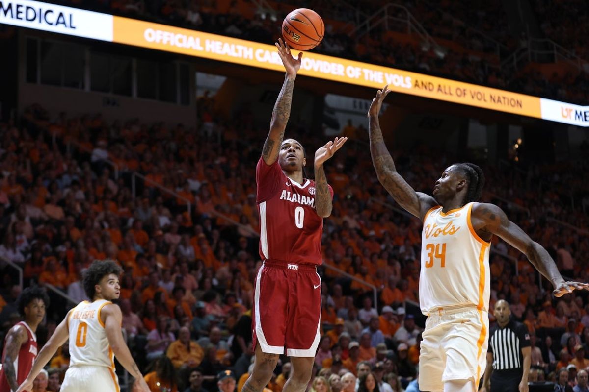 Feb 28, 2026; Knoxville, Tennessee, USA;  Alabama Crimson Tide guard Labaron Philon (0) shoots the ball against Tennessee Volunteers center Felix Okpara (34) during the second half at Thompson-Boling Arena at Food City Center. Mandatory Credit: Randy Sartin-Imagn Images