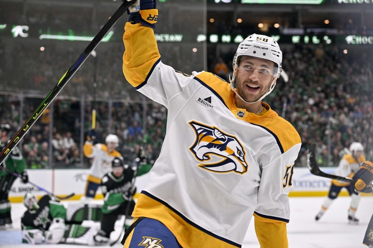 Feb 28, 2026; Dallas, Texas, USA; Nashville Predators left wing Michael Bunting (58) celebrates scoring a power play goal against Dallas Stars goaltender Jake Oettinger (29) during the first period at the American Airlines Center. Mandatory Credit: Jerome Miron-Imagn Images