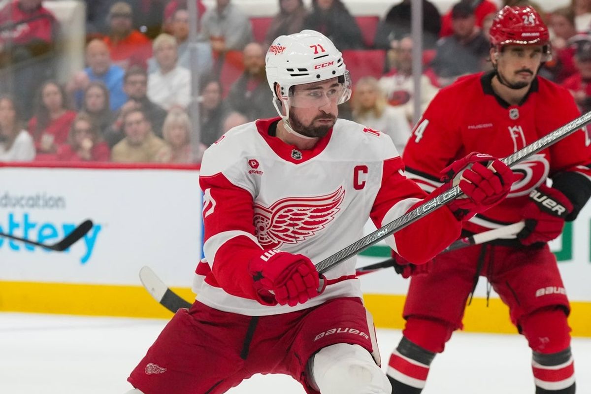 Feb 28, 2026; Raleigh, North Carolina, USA;  Detroit Red Wings center Dylan Larkin (71) takes a shot against the Carolina Hurricanes during the second period at Lenovo Center. Mandatory Credit: James Guillory-Imagn Images