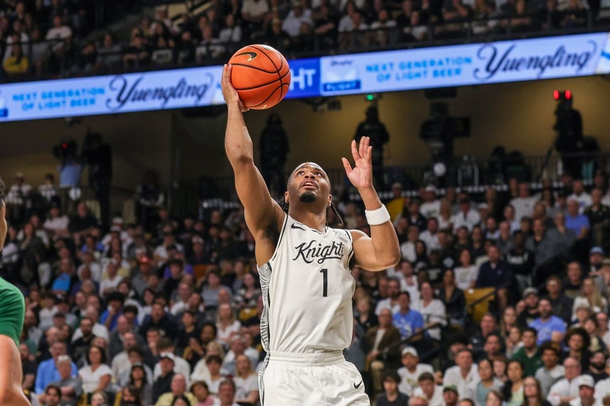 Feb 28, 2026; Orlando, Florida, USA; UCF Knights guard Themus Fulks (1) goes to the basket during the first half against the Baylor Bears at Addition Financial Arena. Mandatory Credit: Mike Watters-Imagn Images