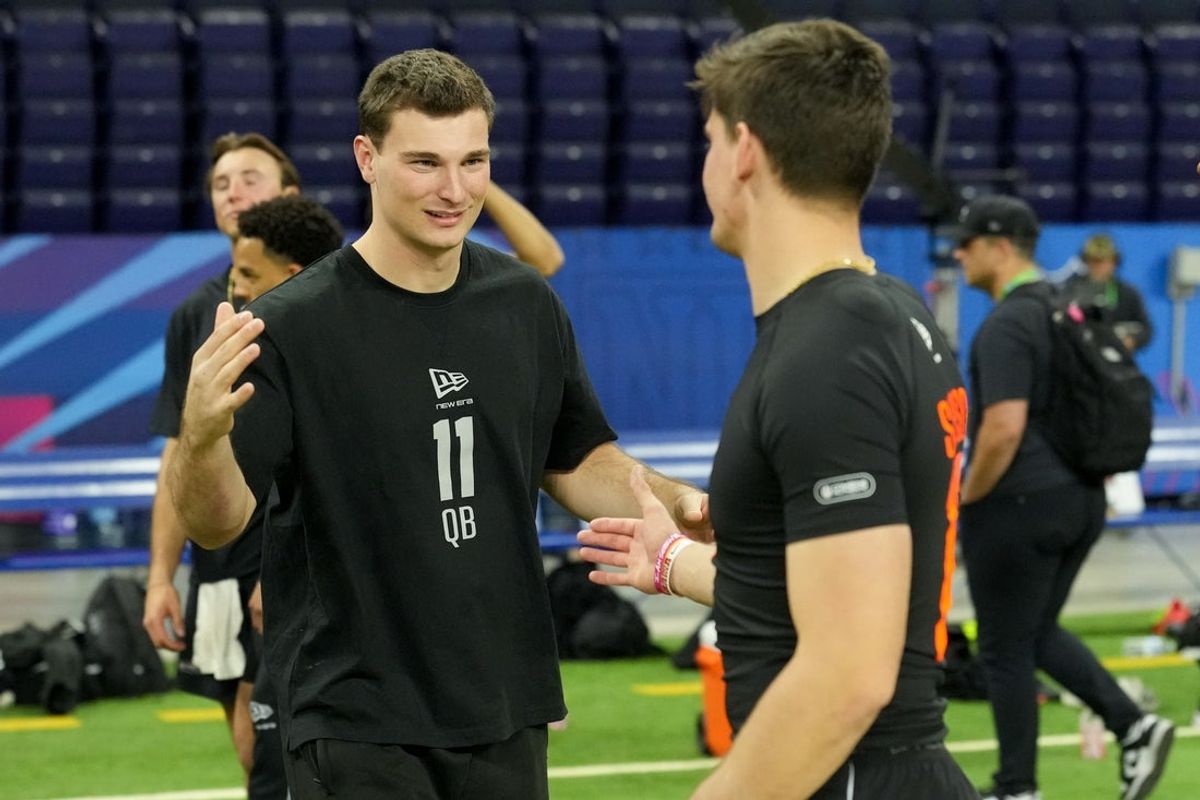 Indiana quarterback Fernando Mendoza -- QB11 at the NFL Scouting Combine -- greets Alabama quarterback Ty Simpson (QB17) at Lucas Oil Stadium. Mandatory Credit: Kirby Lee-Imagn Images