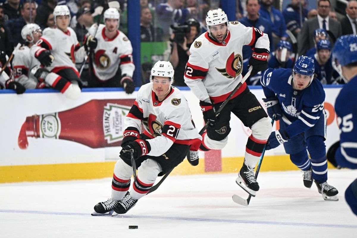 Feb 28, 2026; Toronto, Ontario, CAN;  Ottawa Senators forward Nick Cousins (21) pursues the puck as forward Michael Amadio (22) gets out of his way against the Toronto Maple Leafs in the second period at Scotiabank Arena. Mandatory Credit: Dan Hamilton-Imagn Images