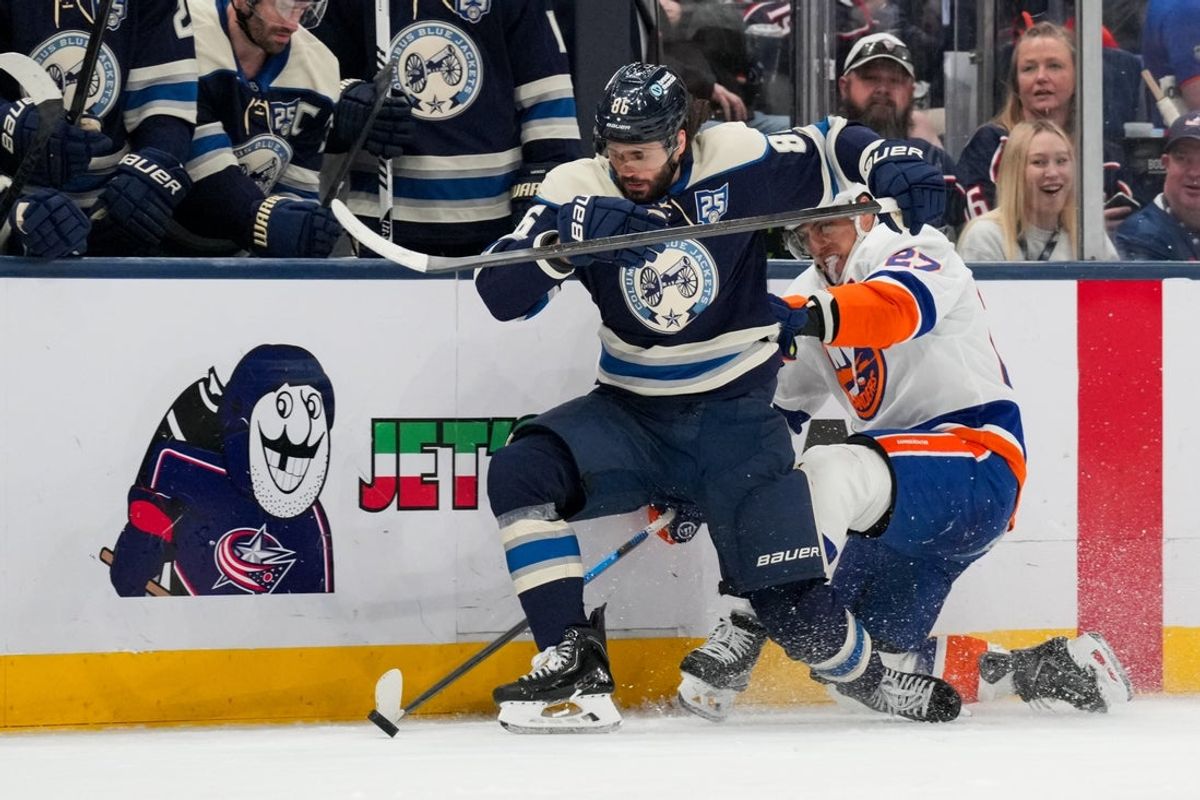 Feb 28, 2026; Columbus, Ohio, USA;  Columbus Blue Jackets right wing Kirill Marchenko (86) skates for the puck against New York Islanders left wing Anders Lee (27) in the third period at Nationwide Arena. Mandatory Credit: Aaron Doster-Imagn Images