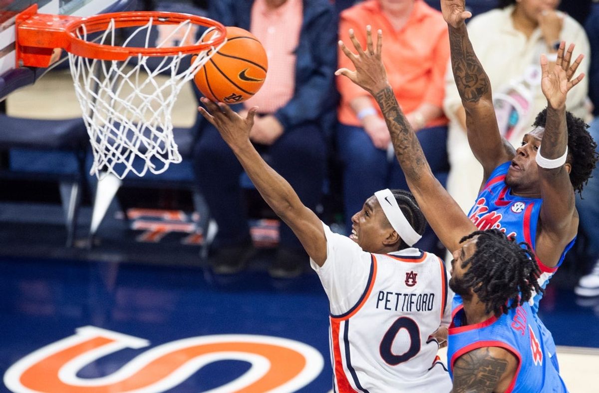 Auburn Tigers guard Tahaad Pettiford (0) goes up for a layup as Auburn Tigers take on Ole Miss Rebels at Neville Arena in Auburn, Ala. on Saturday, Feb. 28, 2026. Ole Miss Rebels defeated Auburn Tigers 85-79.
