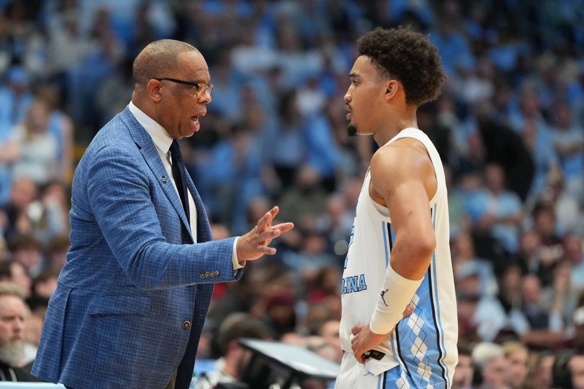 Feb 28, 2026; Chapel Hill, North Carolina, USA; North Carolina Tar Heels head coach Hubert Davis with guard Seth Trimble (7) in the second half at Dean E. Smith Center. Mandatory Credit: Bob Donnan-Imagn Images