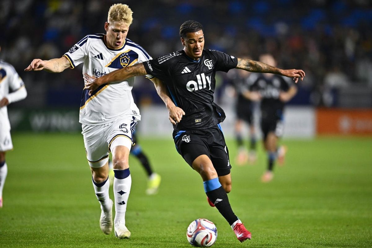 Feb 28, 2026; Carson, California, USA; Charlotte FC forward Idan Toklomati (9) and Los Angeles Galaxy defender Jakob Glesnes (5) battle for the ball during the first half at Dignity Health Sports Park. Mandatory Credit: Kelvin Kuo-Imagn Images
